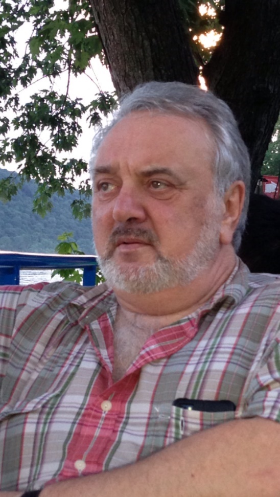 A person with a beard and mustacheAI-generated content may be incorrect.