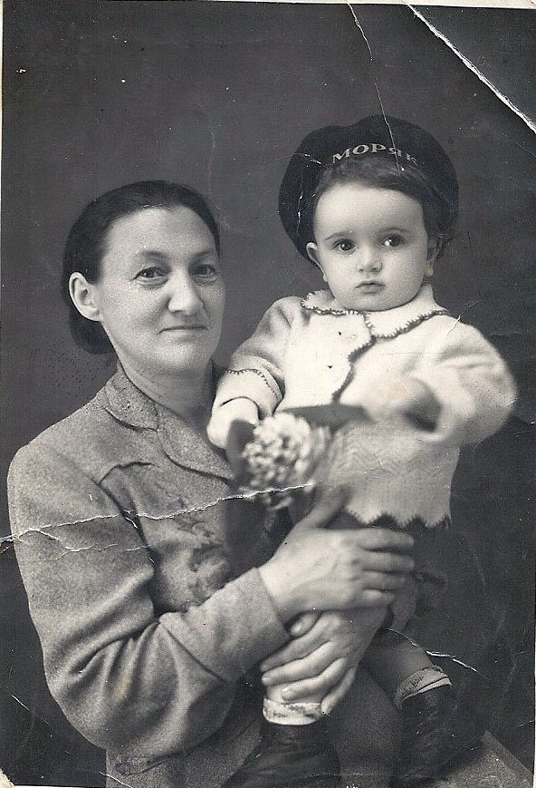 A person holding a babyAI-generated content may be incorrect.