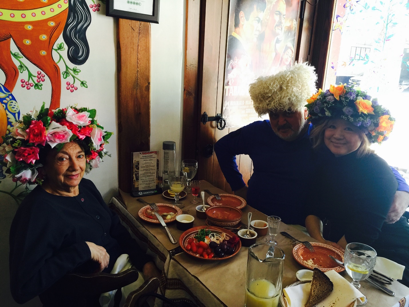 A group of people sitting at a table with foodAI-generated content may be incorrect.