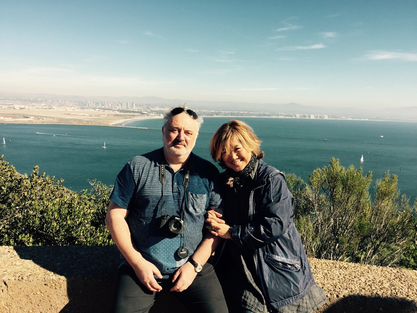 A person and person posing for a pictureAI-generated content may be incorrect.