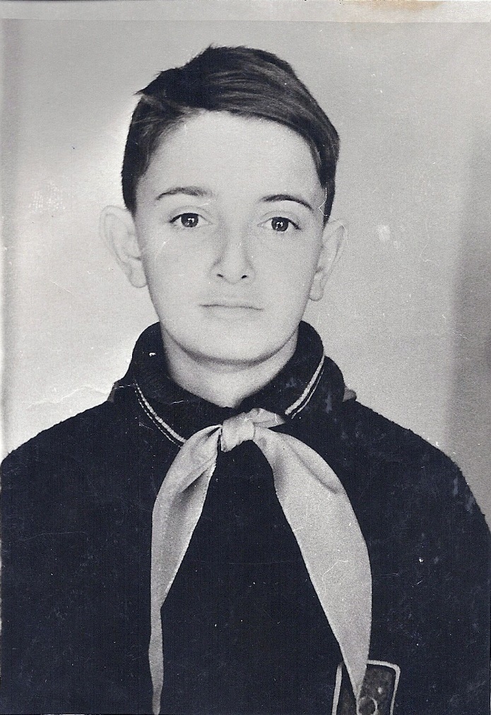 A young child in a uniformAI-generated content may be incorrect.