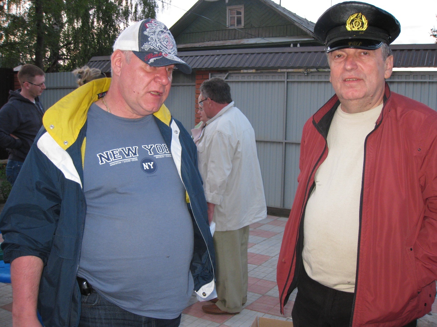 A couple of men standing outsideAI-generated content may be incorrect.