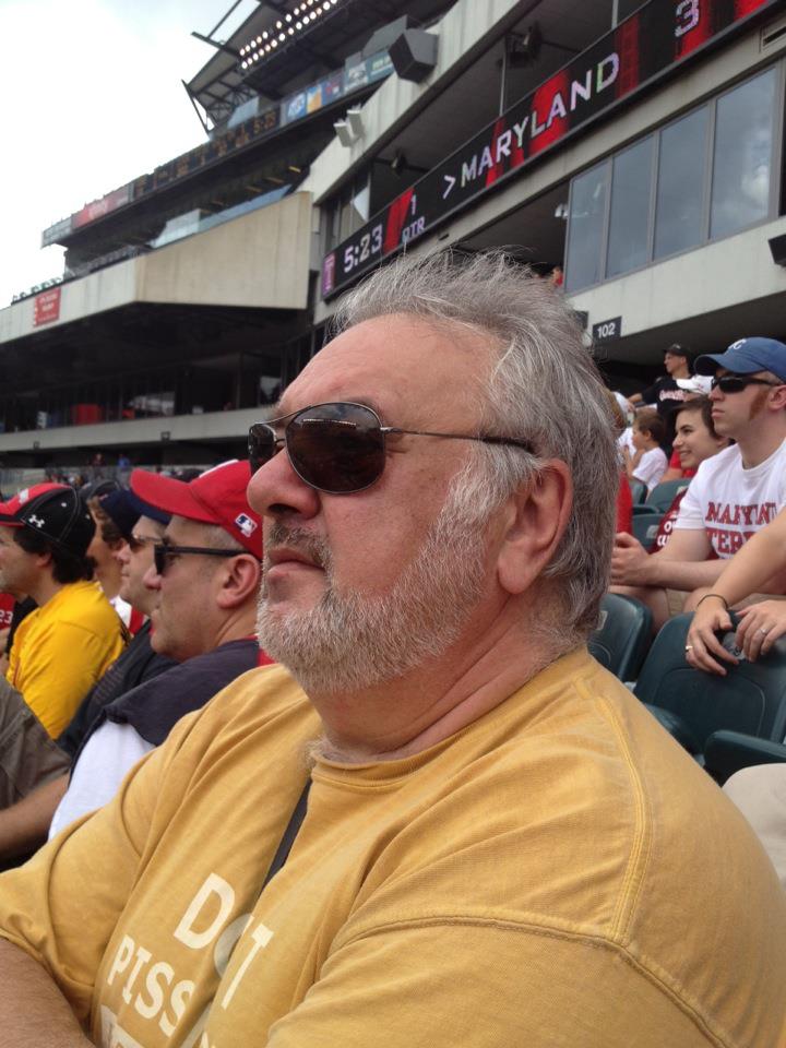 A person wearing sunglasses and a yellow shirtAI-generated content may be incorrect.