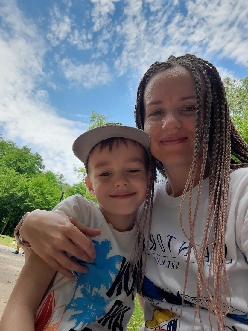 A person and a child posing for a selfieAI-generated content may be incorrect.