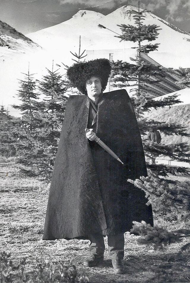 A person in a large hat and capeAI-generated content may be incorrect.