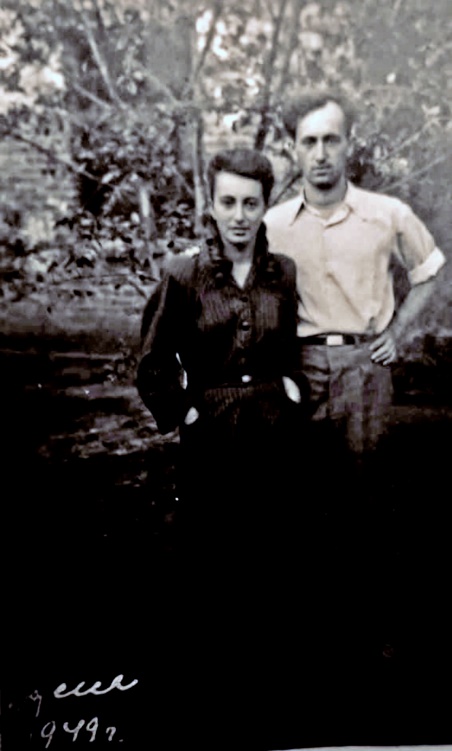 A person and person standing togetherAI-generated content may be incorrect.